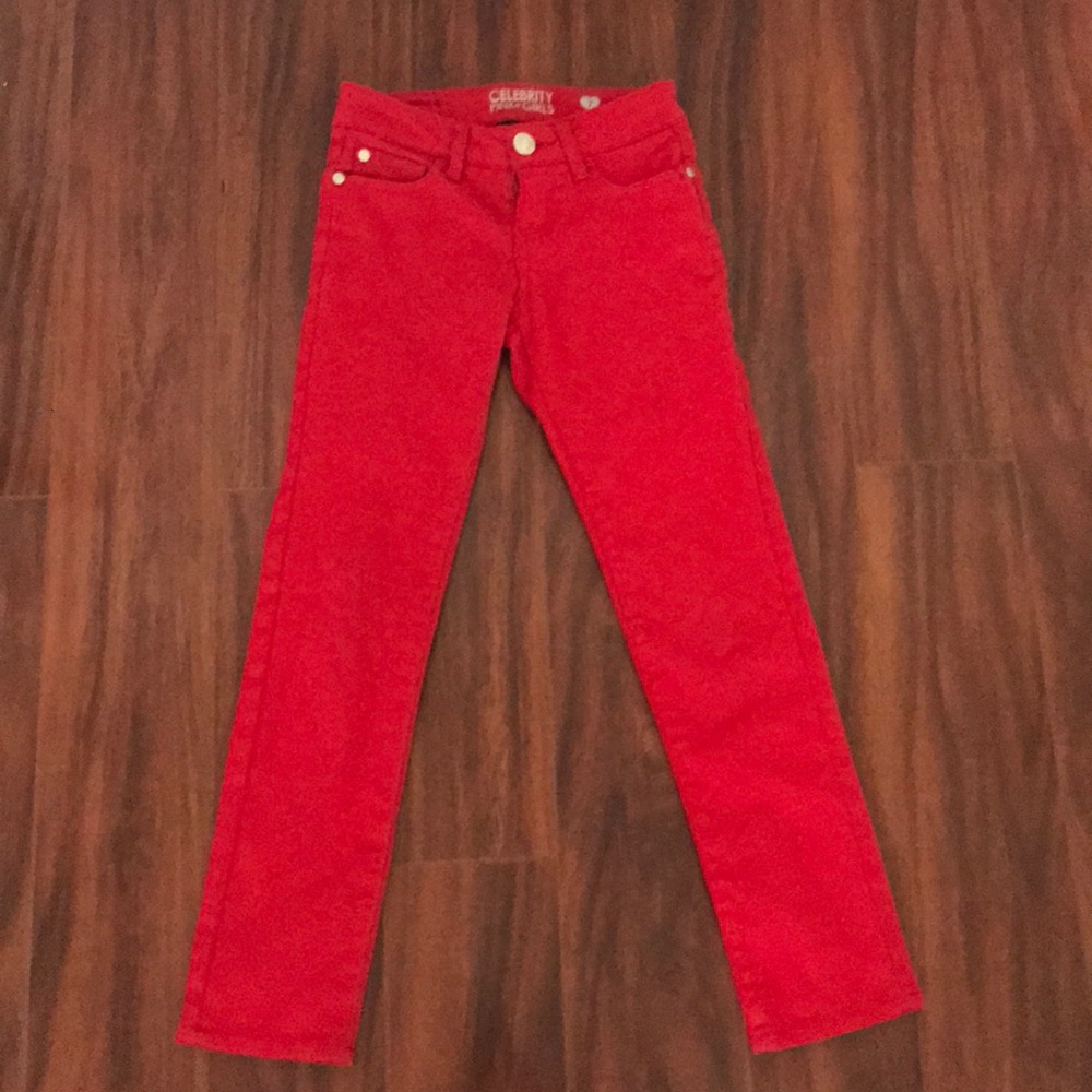 Bright red children’s jeans.